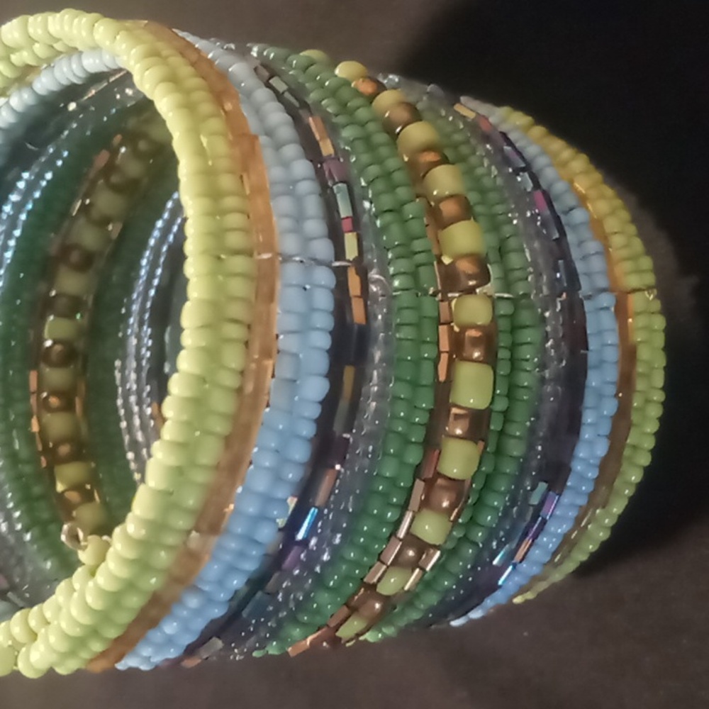Beaded wrap bracelet beautiful blues & greens with gold accents. Adjustable